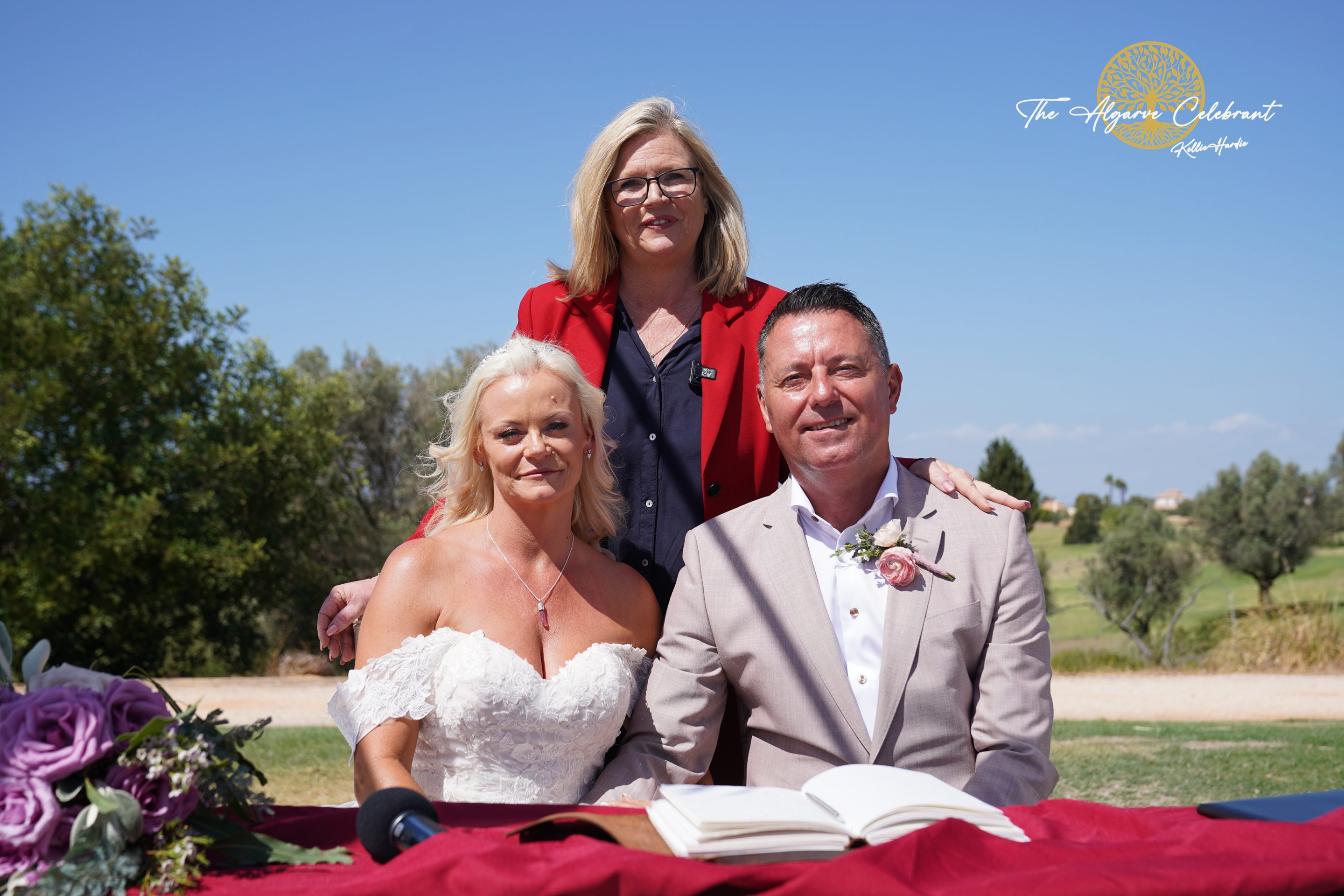 A picturesque outdoor ceremony under the Algarve sun, with Clare and Paul standing hand in hand, surrounded by family and friends in a stunning venue filled with love and joy.