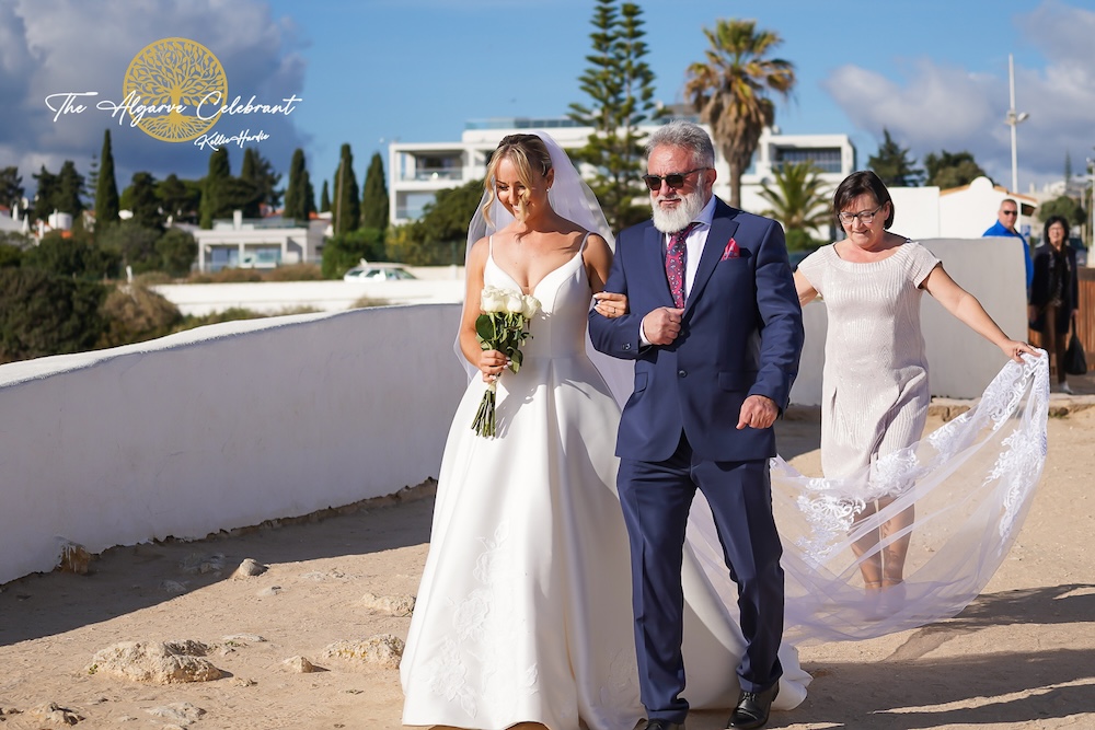 Daniels father Walking Magdalena Down the Aisle: A touching moment as Daniel’s father walks Magdalena down the aisle inside the historic Senhora da Rocha chapel.