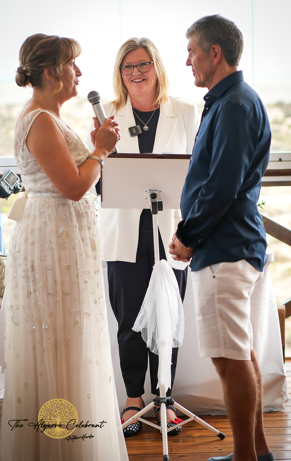 Alan and Marilyn standing together during the ceremony – Alan and Marilyn exchanging vows. Alan and Marilyn standing together during the ceremony – Alan and Marilyn exchanging vows.